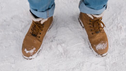 male feet in boots walking in winter snow top view 2025 02 25 02 10 24 utc
